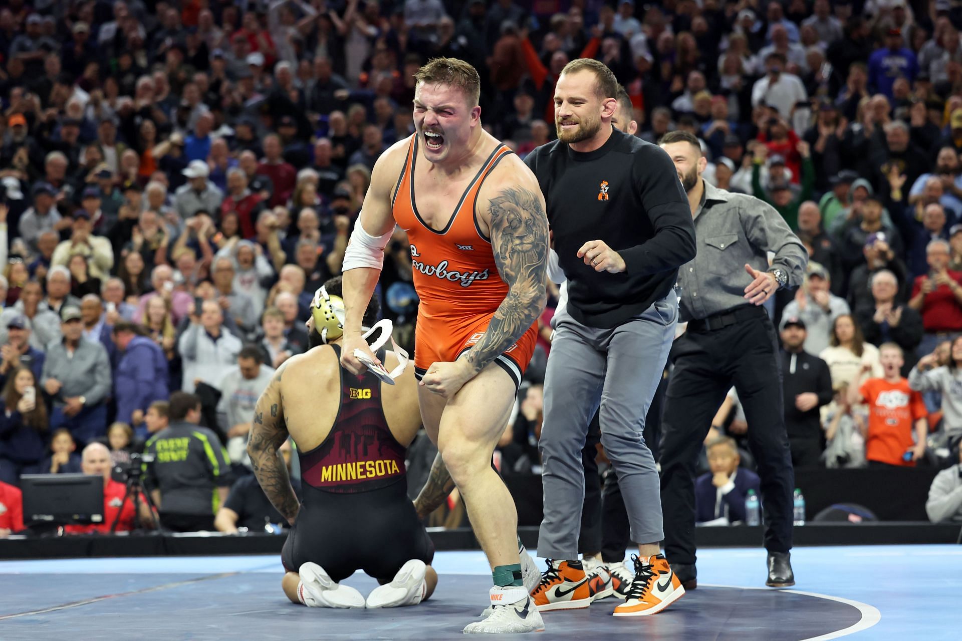 David Taylor (R) at the 2025 NCAA Division I Men's Wrestling Championship - Source: Getty
